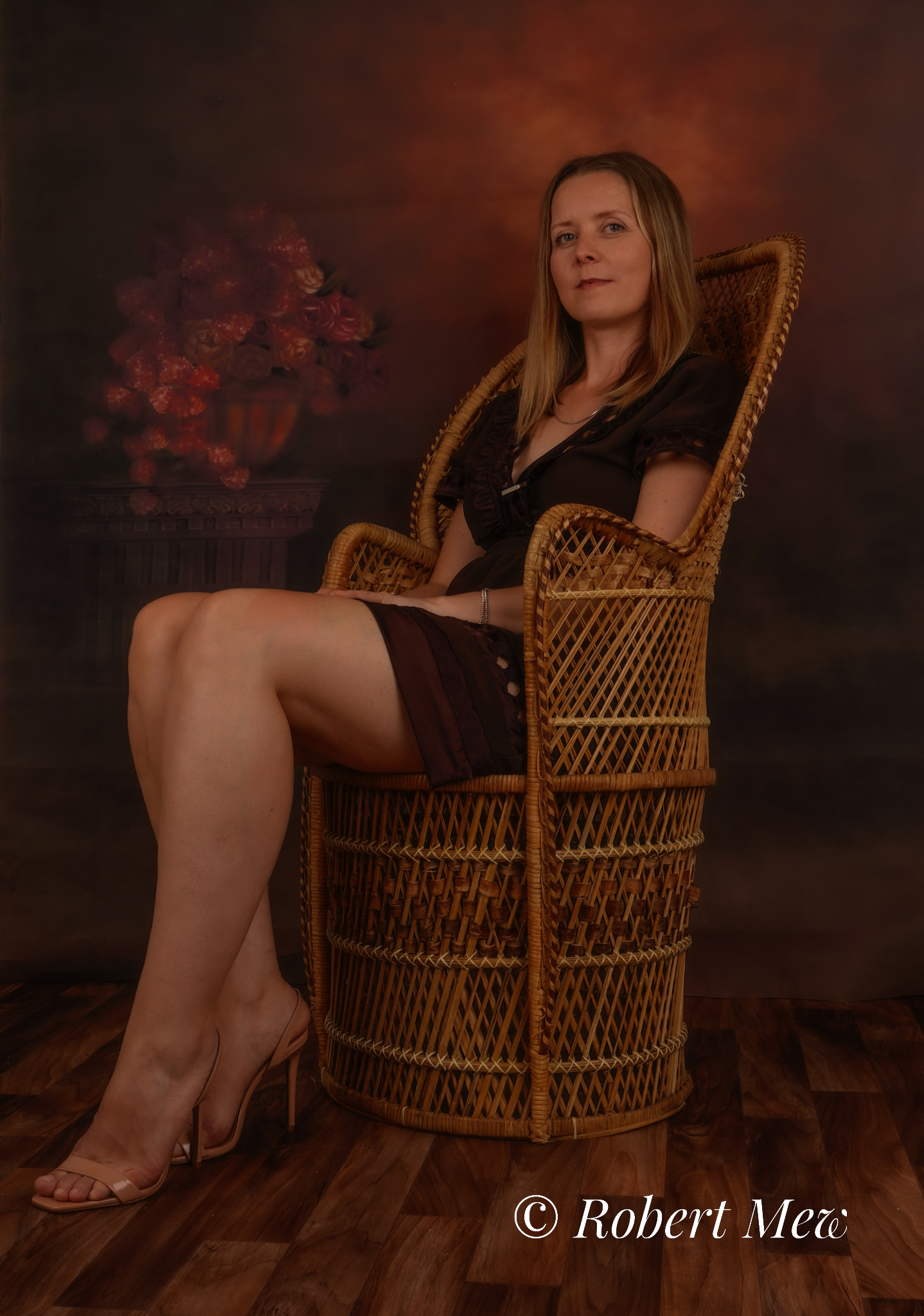 woman sat in seat as a sitter with a vintage backdrop